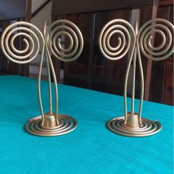 Gold colored metal 7 inch tall pair of candle stick holders