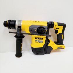 DEWALT 60V MAX brushless rotary hammer has a yellow and black plastic housing. This tool is part of the FLEXVOLT system and includes an SDS Plus bit s