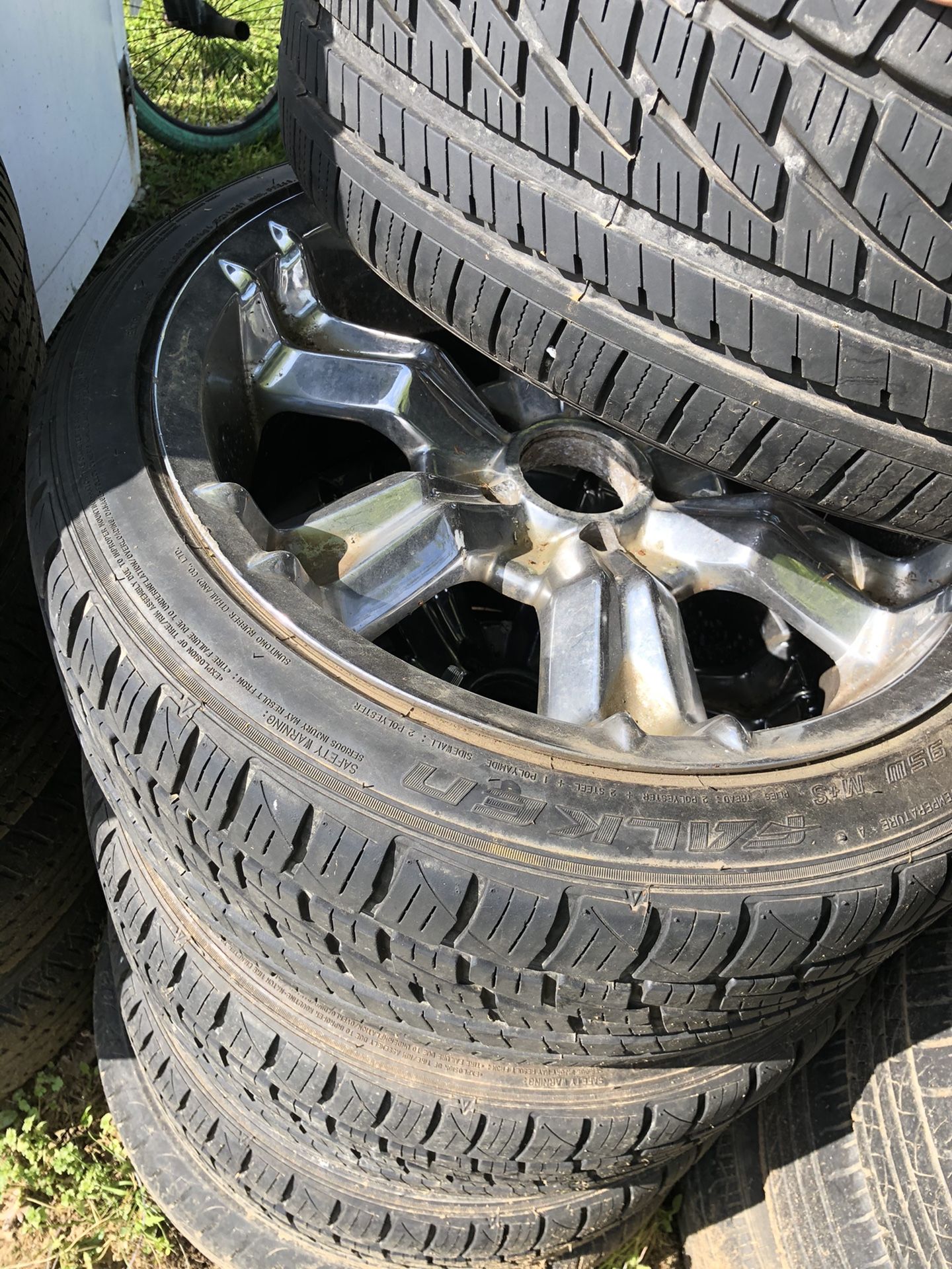 5 lug chrome chevy rims and low profile tires great tread. Also has 1 1/2 inch wheel spacers