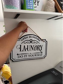 Metal laundry sign