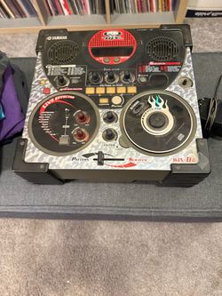 (1) Yamaha DJX-IIB DJ mixer and rhythm machine with built-in speakers, featuring a gray patterned design, live effector controls, and a decorative scr