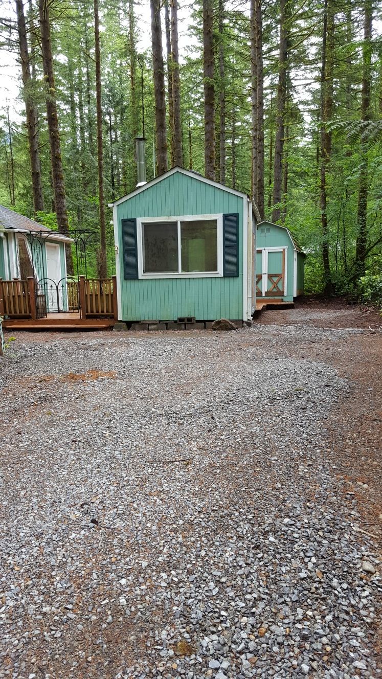 This rv site has an enclosed deck, gazebo, deck and shed.