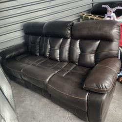 Brown couch and love seat