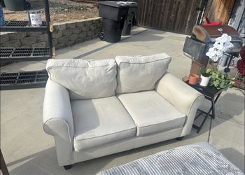 Beautiful white loveseat.