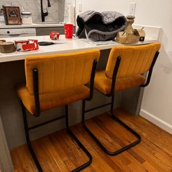 ORANGE COUNTER HEIGHT CHAIRS