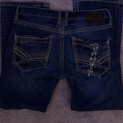 Blue bootcut jeans with a free chrome hearts chain
