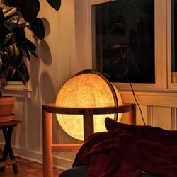 Illuminated vintage Replogle Heirloom 16" globe on an oak stand is a true gem for collectors. The multi-color world map b