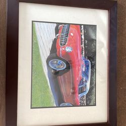 Framed pictures of a vintage corvette 15$ 