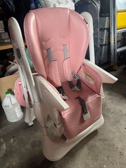 Pink adjustable highchair.