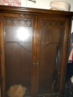 Antique gun cabinet