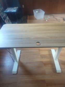 Work desk raises and lowers