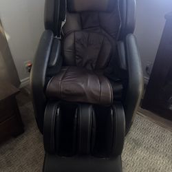 A reclining massage chair,