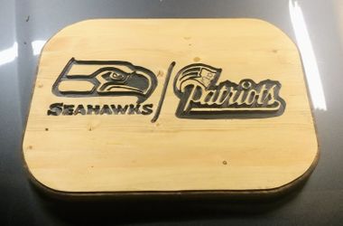 Wood sign seahawks vs patriot fans