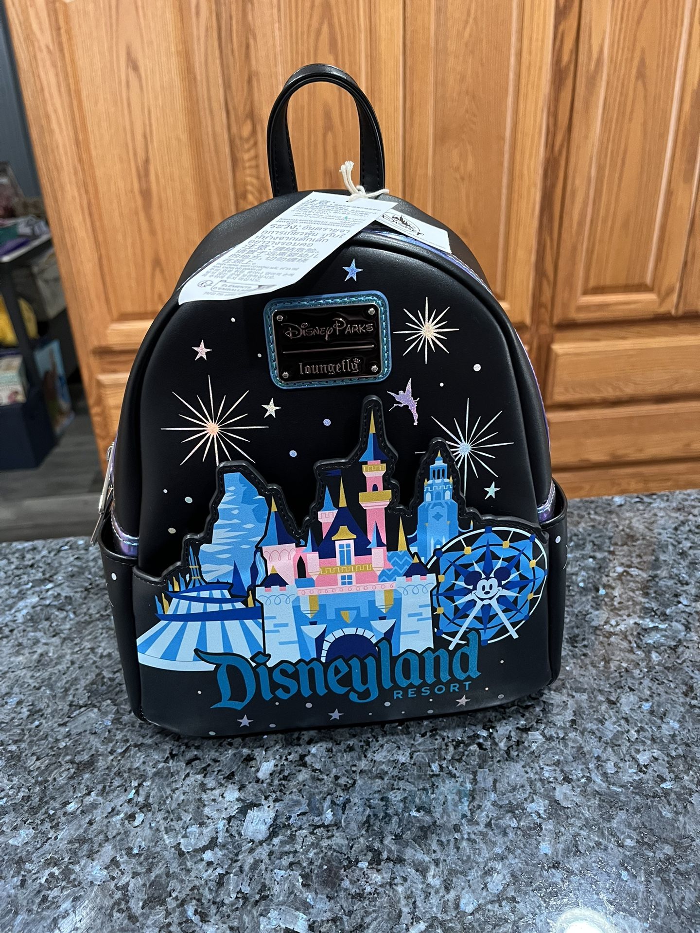 Disney Loungefly Disneyland  Mini Backpack Castle Matterhorn.  Brand new with tags.  Smoke free home 