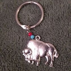 New Key Chain Of A Buffalo Silver Tone Red And Blue Beads.