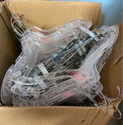 box of clear, plastic hangers with clips