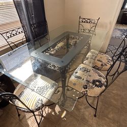 6 Ft Glass And Wrought Iron Table And Chairs 