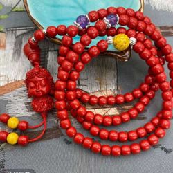 Cinnabar Long Multi-Strand Beaded Necklace with Pendant 。
