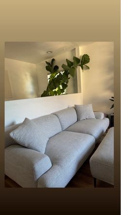 Article light grey lounge and Ottoman