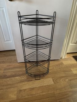 black metal three-tier corner shelf unit
