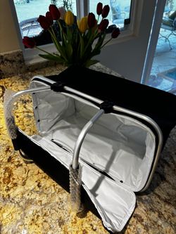 Brand new picnic / lunch basket. Still has the wrap on the handles. 19 inches long, 10 inches wide, 11 inches deep.  An adorable black canvas with a z