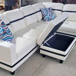 New White Leather Sectional And Ottoman 