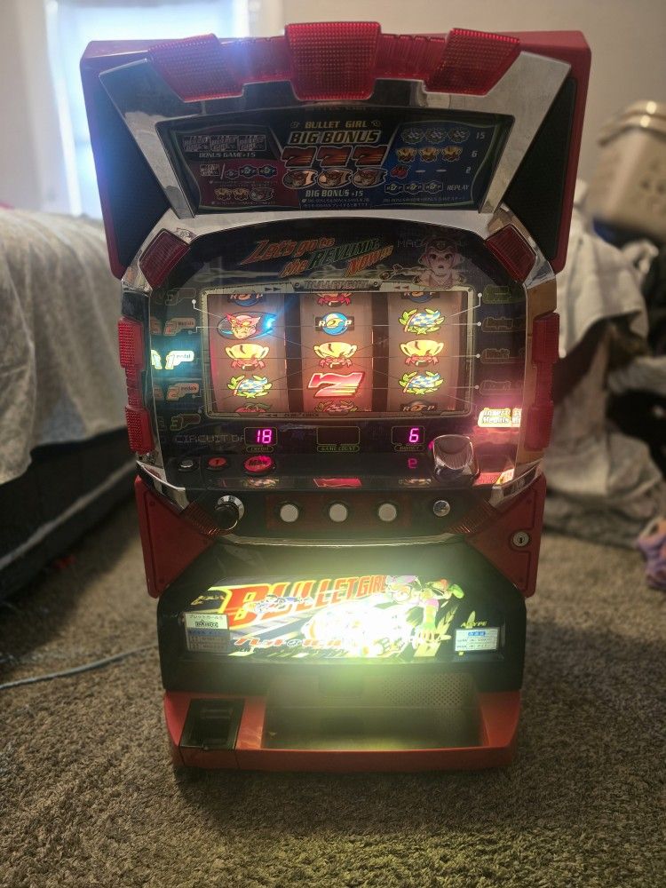 Bullet girl arcade machine takes slot coins not quarters good condition fun to play withHas a little damage to back card board not bad tho