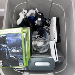 Bin Of 5 Video Game Consoles With Controllers, 19 Games, And Accessories