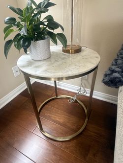 Two marble side tables