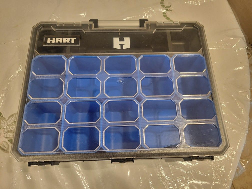 Black and blue plastic organizer with multiple compartments.