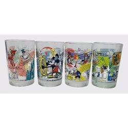  Walt Disney 100 Years of Magic McDonald's Complete 4 Glass set 2002. They include Pixar's Buzz Lightyear, Mickey Mouse, Pinocchio, and Goofy.  