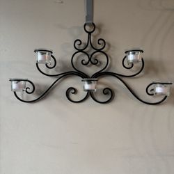 black metal five-cup wall-mounted tealight or votive candle holder