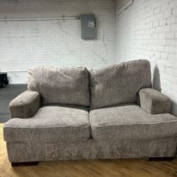 Delivery available Ashley furniture sofa/couch and loveseat set