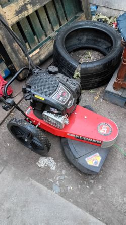 Weed eater/mower cuts down  anything in this bad 6.75 HP new
