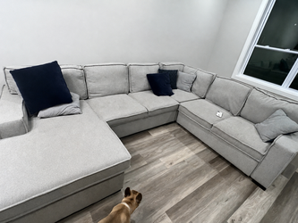Big grey couch- storage and turn to a bed