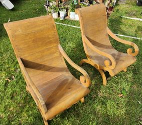 2 large teak arm chairs