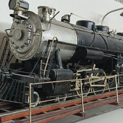 It is an antique, over 100 years old, custom built in 1919. It is approximately 5ft long on a turn table and it moves back and forth, very fragile, as