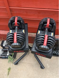 Bowflex dumbbells with stand
