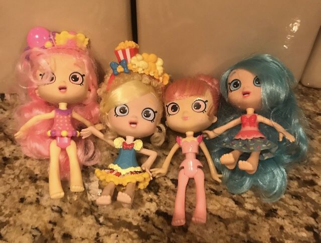 4 Shopkins  dolls. Neat Condition . 