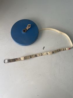 Vintage large print retractable by hand) fabric measuring tape. 