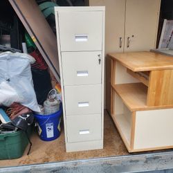 Four Drawer Vertical File Cabinet With All The Linings On The Inside And Have A Lock And Key Is Very Heavy And It's An Excellent Condition