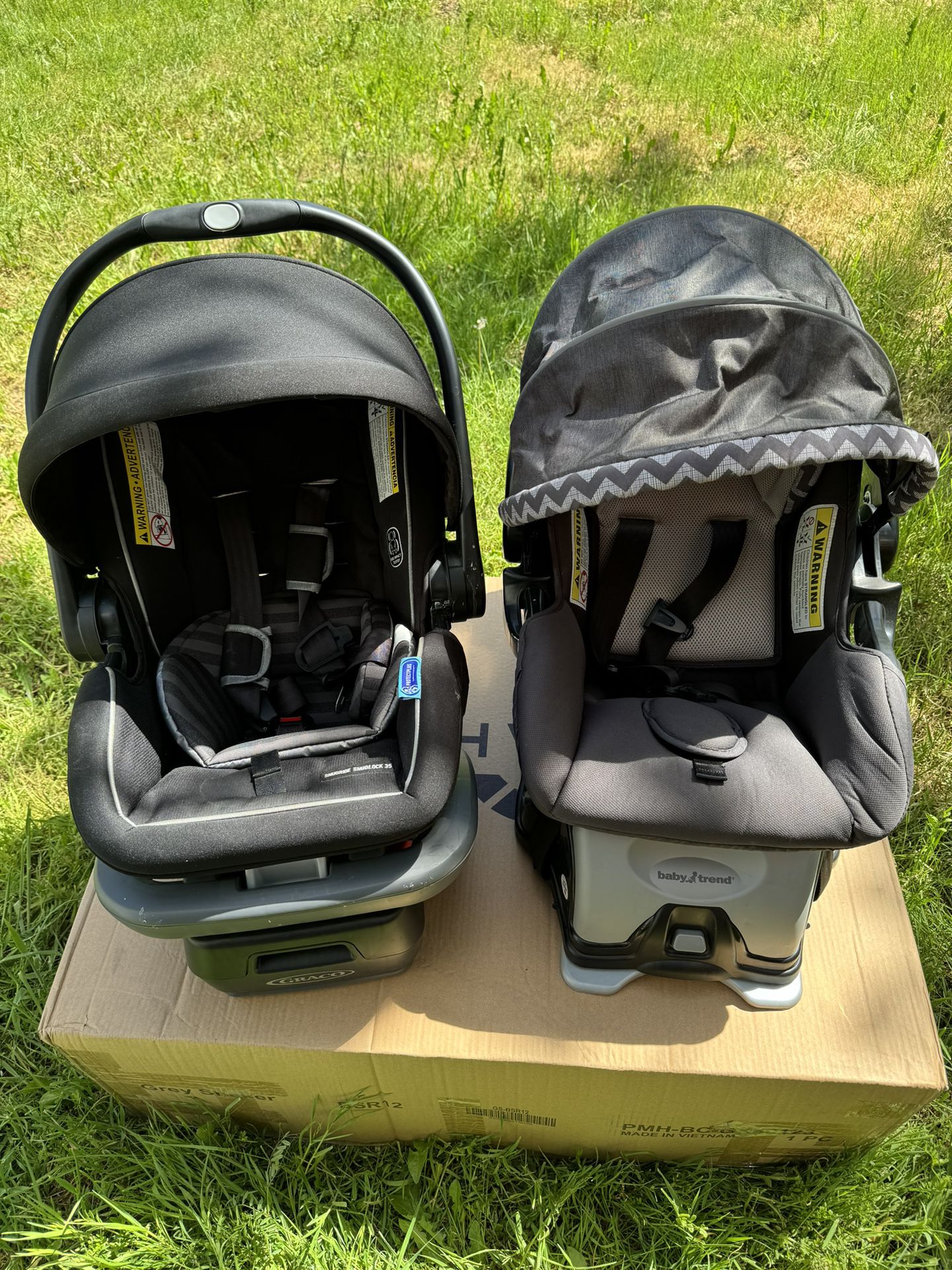 two newborn baby carrier with base