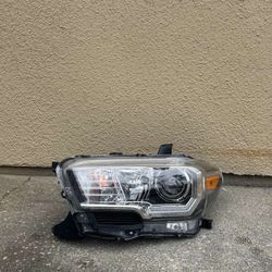2016-2021 Toyota Tacoma Driver Side Head Light OEM 