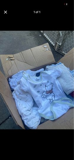 Box full of baby boy clothes