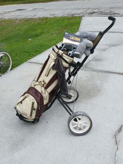 Men's golf clubs with walking caddy