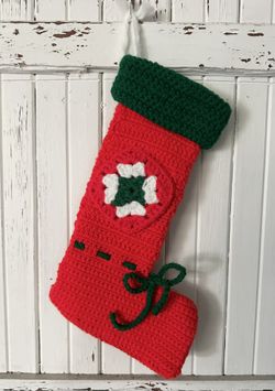 Vintage handmade crocheted red granny square patch Christmas stocking with green cuff.  12” long. Loop for hanging