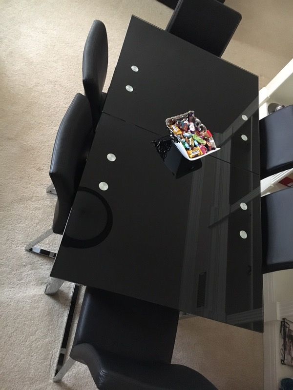 MODANI FURNITURE; BLACK TEMPERED GLASS ADJUSTABLE TABLE (USED)