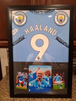 ERLING HAALAND OF THE MANCHESTER SOCCER TEAM, BRANDED,AUTHENTIC FRAMED JERSEY.