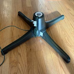 rotating Christmas tree stand, designed to hold an artificial tree while spinning it slowly