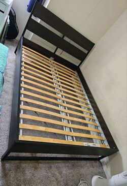 Full size dark wood and matte black metal bed frame